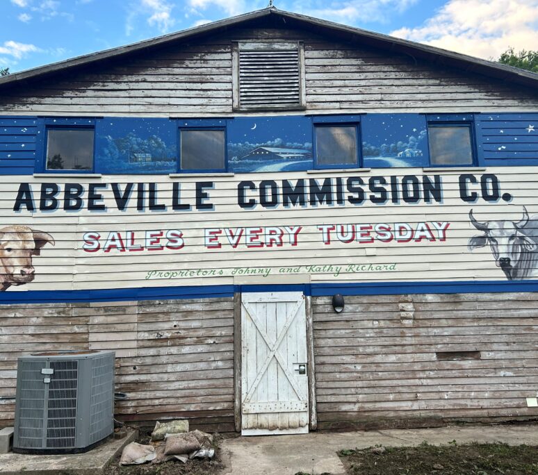 Mural on the front of the Richard Sale Barn reading Abbeville Commission Co.